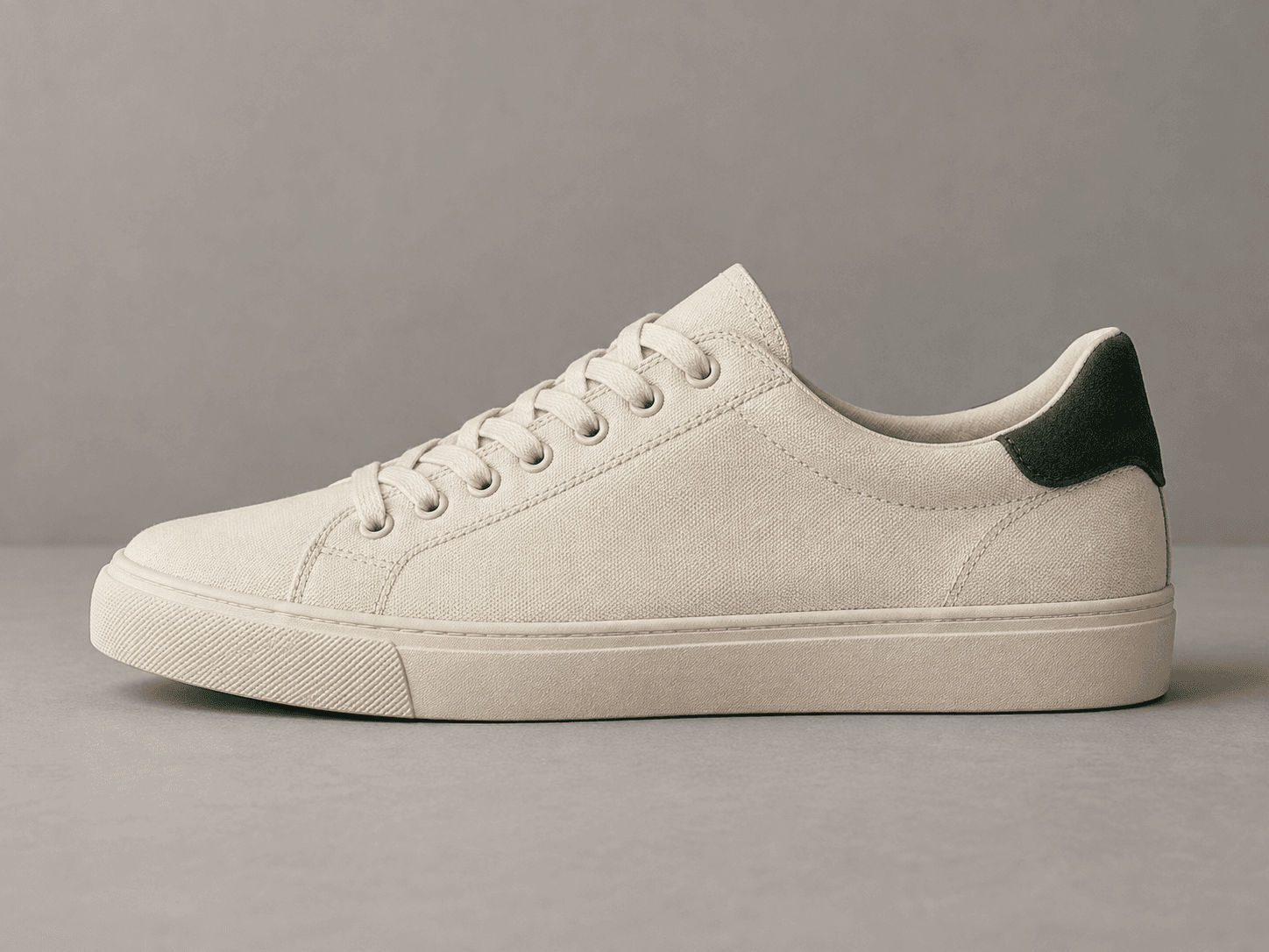 Cream canvas sneaker in soft studio light